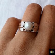 "Synthetic Pearl Silver Ring, Star Shape Mens Ring, Mid Finger Silver Ring, Bezel Set Pearl Ring, Men's Silver Ring, Gift for my boyfriend, Silver By Kumkum * SKU: KJ-R-M-60 * Gemstone: Pearl ( Synthetic) * Gem color: White * Band color: Silver * Metal Purity: 925 * Weight: Approx. 4.58 Grams ✾Our Special Features✾ ✪ 𝐢𝐅 𝐲𝐨𝐮 𝐜𝐚𝐧 𝐃𝐑𝐄𝐀𝐌 𝐢𝐭 𝐭𝐡𝐞𝐧 𝐰𝐞 𝐜𝐚𝐧 𝐂𝐑𝐀𝐅𝐓 𝐢𝐭 𝐰𝐢𝐭𝐡 𝐋𝐎𝐕𝐄 ★Silver by Kumkum can frame your Dream as per your choice a We love to make Personalized Custom-Made Orders in ❁ 10K/14K/18K/22K/24K Solid White/Yellow/Rose Gold ❁ Sterling Silver 925 Metal Options [Hip Hop Jewelry, Engagement-Wedding Ring Set, Earrings, Pendant, Bracelets, Necklace, Eternity Band, Jewelry Set] 🔶 Follow these 𝐄𝐚𝐬𝐲 𝐒𝐭𝐞𝐩𝐬 to get your dream jewelry ☟ 👉 Send us All Mens Pearl Ring, Pearl Ring For Men, Gift For My Boyfriend, Mid Finger, Mens Silver Ring, Natural Pearl Ring, White Pearl Ring, Silver Pearl Ring, Silver Ring Designs