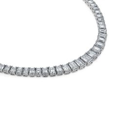 This magnificent tennis necklaces is designed with graduated sizes of Emerald Cut diamonds, a modern take on a classic style. Available in 18K White, Yellow and Rose Gold Diamond weight = 31.36 carats Diamond quality = K/VS1+ Necklace length = 16in Diamond White Tennis Necklace With Baguette Diamonds, White Gold Diamond Tennis Necklace With Baguette Cut, Diamond Baguette Cut Tennis Necklace, Luxury Diamond Baguette Cut Tennis Necklace, Baguette Cut Diamond Tennis Necklace, Classic Tennis Necklace With Baguette Diamond Cut, Classic Baguette Cut Diamond Tennis Necklace, Formal Diamond White Tennis Necklace With Baguette Diamonds, Diamond Tennis Necklace With Baguette Cut