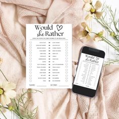 a printable wedding checklist with flowers and a cell phone on the table next to it