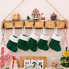 christmas stockings hanging from a wooden shelf