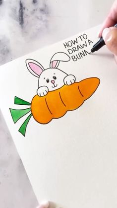 someone is drawing a cartoon bunny holding a carrot