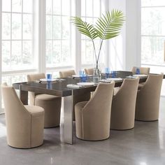 a dining room table with chairs around it