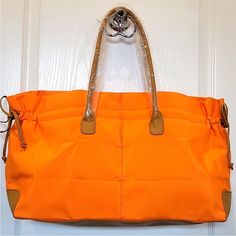 Nwot Lancome Orange Nylon Large Tote Beautiful Lancome Orange Nylon Large Tote. New Without Tags, No Stains, And No Rips. Approximate Measurements: 21.5" X 11.5" X 6" Large Tote, Color Orange, Orange, Tags, Women Shopping, Color