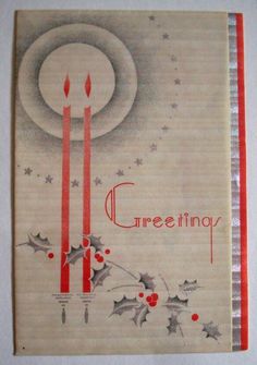 an old christmas card with two candles and holly berries on the front, surrounded by stars