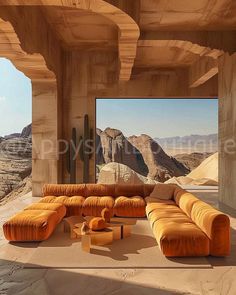 a living room filled with orange couches next to a large window covered in desert mountains