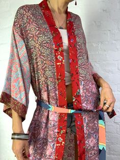 "This is colourful long silky robe made patchwork maxi long with pockets and split, easy to wear wrap tie closing made free size real boho cover up, perfect to wear on its own or layered ower jeans and tshirt length 54\" more available at https://www.etsy.com/shop/AltheaStores?ref=seller-platform-mcnav Thank You for looking" Spring Robe With Patchwork And Kimono Sleeves, Spring Bohemian Patchwork Robe, Bohemian Patchwork Robe For Spring, Multicolor Patchwork Robe For Spring, Multicolor Patchwork Robe For Summer, Multicolor Summer Robe With Patchwork, Multicolor Patchwork Summer Robe, Spring Festival Kimono With Patchwork, Bohemian Silk Wrap Robe