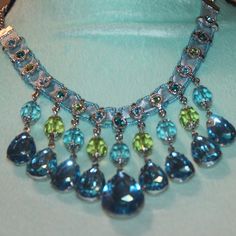 Nwtags: Aqua Blue Teardrop Necklace, Has Lime Green Beads And Rhinestones Around The Top, 18" Chain, 3" Teardrops In The Middle, Has A Row Of Round Small Rhinestones Up On The Top Of The Necklace, Elegant Blue Beaded Necklaces With Gemstone Accents, Elegant Blue Beaded Necklace With Gemstone Accents, Blue Drop Necklace For Party, Blue Dangle Beaded Costume Jewelry Necklace, Blue Teardrop Drop Necklace For Party, Elegant Blue Crystal Necklace With Gemstone Accents, Elegant Blue Dangle Crystal Necklaces, Elegant Blue Crystal Necklaces For Parties, Blue Crystal Rhinestone Costume Necklace