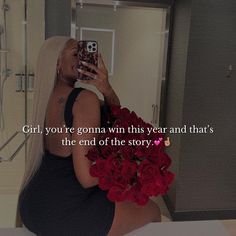 a woman taking a selfie in a bathroom with flowers on the bed and text overlay