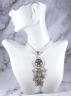 This beautiful chain necklace is the perfect way to express your affinity for Apollo.Pendant is made with four charms:PentacleSunLyreBow & Arrow3 genuine sunstone beads and one amazonite bead also make up the pendant.Available in a variety of lengths. Secured with a lobster clasp that can fit in any of the links on the chain, making it easily adjustable.Metal is zinc alloy and beads are natural gemstone. All materials are lead and nickel free.Comes in a jewelry box so it’s ready to be given Spiritual Charm Necklaces With Dangling Charms, Spiritual Dangle Charm Necklace With Adjustable Chain, Spiritual Silver Charm Necklaces With Gemstone Beads, Spiritual Sterling Silver Necklace With Dangling Charms, Greek Mythology Jewelry, Mythology Jewelry, Chain Making, Pagan Witch, Roman Mythology