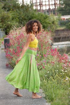 Cool, breezy upcycled sari skirt. Made of beautiful light fabric that's great for summertime lounging. It flows and floats as you walk, a very elegant and feminine skirt.  SIZE  ONE SIZE:  Trousers waistband = 28-36" (71-91.5 cm) Trousers length = 36" (91.5 cm) THIS LISTING IS FOR BRIGHT GREEN Also available in other colours, please check our listings. Code: DRAGONFLY SKIRT (SDDFLY) Green Bohemian Maxi Skirt For Festival, Bohemian Green Maxi Skirt For Festivals, Bollywood Style Long Skirt For Summer, Bohemian Green Bottoms With Gathered Skirt, Green Hippie Maxi Skirt For Festival, Hippie Festival Gathered Skirt Bottoms, Hippie Festival Bottoms With Gathered Skirt, Hippie Green Skirt For Festival, Fitted Green Hippie Skirt