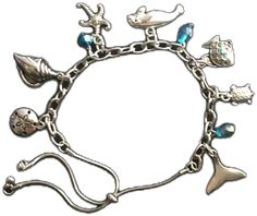 Beach Jewelry With Metal Charms, Metal Charm Bracelets For Beach, Beach Jewelry With Lobster Clasp, Beach Metal Bracelets With Charms, Adjustable Silver Bracelets With Ocean-inspired Style, Beach Metal Jewelry With Starfish Charm, Adjustable Silver Bracelet With Ocean-inspired Style, Silver Adjustable Ocean-inspired Bracelets, Adjustable Silver Ocean-inspired Bracelets