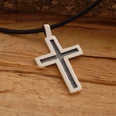 "This handmade oxidized sterling silver cross pendant features a unisex design that is modern, yet elegant, combining just the right amount of style and grace. It is an ideal jewelry option for either a man or woman. Suspended from a sterling silver chain or a black leather cord 48cm long with silver clasp and endings, it is the perfect way to share your message of faith with those around you. It also makes a modern fashion statement that makes an exceptional gift for anyone on your gift list. Y Oxidized Cross Pendant Necklace, Oxidized Sterling Silver Cross Pendant Necklace, Sterling Silver Oxidized Crucifix Necklace, Gift Sterling Silver Cross Necklace With Oxidized Finish, Sterling Silver Oxidized Cross Necklace, Gift Oxidized Cross Pendant Necklace, Oxidized Cross Pendant Necklace For Gift, Oxidized Finish Cross Necklace For Gifts, Oxidized Finish Cross Necklace As Gift