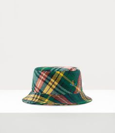 Tartan is a key pattern of the house's heritage, capturing Vivienne’s signature punk aesthetic. This season’s bucket hat showcases a tartan pattern inspired by the fabric from Vivienne Westwood’s Autumn-Winter 1993 'Anglomania' collection, complete with an embroidered orb on the front - a nod to Vivienne’s vision of taking tradition into the future. Eastpak Backpack, Punk Aesthetic, Into The Future, S Signature, Tartan Pattern, Knitwear Tops, Bridal Couture, Vivienne Westwood, Wool Coat