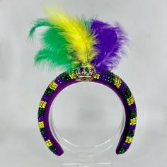 Unleash your inner carnival queen as this sparkly headpiece has you crowned as the Queen of Mardi Gras! Laissez les bon temps rouler *Locally hand made in New Orleans. Headpieces usually ship within 3-5 business days. Please be aware that due to the unique and handmade nature of each product, color, shapes, and sizes may vary slightly from the photo and descriptions. Adjustable Headpiece For Mardi Gras Party, Adjustable Mini Hat For Mardi Gras Costume Party, Adjustable Crown Costume Accessories For Party, Adjustable Headband Costume Hats For Carnival, Carnival Costume Hats And Headpieces With Matching Headband, Adjustable Headpiece For Party And Carnival, Adjustable Crown Costume Hat For Party, Adjustable Party Headpiece With Rhinestones, Adjustable Rhinestone Headpiece For Party