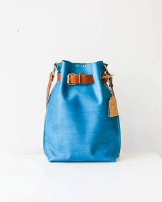 Women's Leather Bag, Leather Backpack, Leather Rucksack, Convertible Backpack, Cross Body Bag The leather backpack, you just can't keep your eyes off! The most beautiful color combination imaginable. This blue beauty is Handmade from finest leather, very practical to use on everyday bases. You can even choose how to use it- As a Convertible bag- Cross body Bag, Backpack, Handbag, or as just an awesome Cross body bag no one can resist. The belt of beg is super adjustable and it gives you the oppo Large Capacity Blue Leather Backpack, On-the-go Leather Bucket Backpack, Blue Leather Backpack With Large Capacity, Daily Use Backpack With Leather Handles As Shoulder Bag, Everyday Standard Backpack With Dust Bag, Blue Leather Backpack With Removable Pouch, Leather Crossbody Bucket Bag For School, Rectangular Leather Backpack With Dust Bag For Travel, Everyday Leather Bucket Backpack