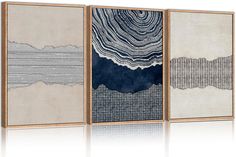 three canvases with an abstract painting on them