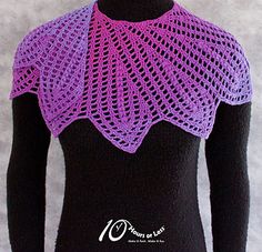 a woman wearing a purple knitted top