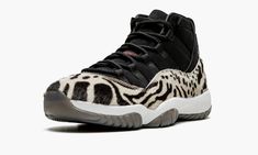 The Women’s Air Jordan 11 “Animal Instinct” is a women’s-exclusive colorway of the vintage basketball shoe with three different animal-inspired patterns on its luxurious design.  A Holiday 2021 release by Jordan Brand, the “Animal Instinct” is one of the boldest colorways of Michael Jordan’s eleventh signature shoe ever produced by Jordan Brand.  The look, which borrows stealthy, black-based design elements from the shoe’s “Cap and Gown” colorway, is complete with a black leather upper with a fa Jordan Retro 11, Animal Instinct, Nike Air Jordan 11, Retro 11, Womens Air Jordans, Air Jordan 11 Retro, Jordans Women, Air Jordan Retro, Air Jordan Sneakers