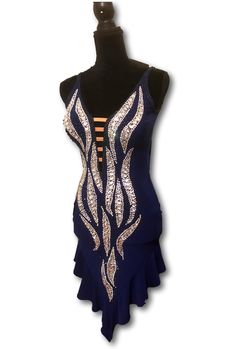 a mannequin wearing a blue dress with silver sequins on the back