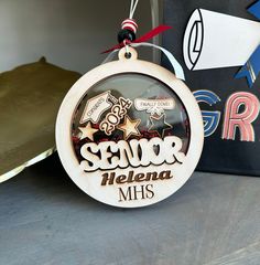 a wooden ornament that says senior mellena mss