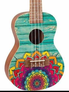 the ukulele is painted with colorful designs