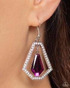 A faceted purple gem swings from the top of a trapezoidal silver frame that is dotted in glassy white rhinestones, creating a prismatic lure. Earring attaches to a standard fishhook fitting.   Sold as one pair of earrings. Faceted Crystal Jewelry For Parties, Purple Jewelry With Sparkling Stones For Party, Party Crystal Jewelry With Faceted Details, Purple Crystal Metal Earrings For Party, Silver Faceted Earrings For Party, Faceted Dangle Jewelry For Party, Unique Purple Jeweled Dangle Jewelry, Faceted Crystal Earrings For Party, Purple Drop Jewelry For Party