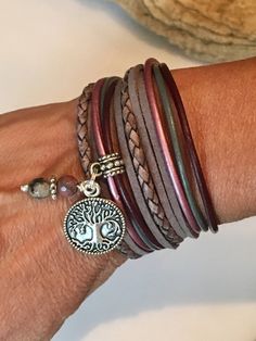 This bracelet is Perfect if you like the boho style with natural leather with that cool Boho Style! Beautiful shades of Gray, burgundy and berry made with genuine bolo braided cord, soft suede cord and 2mm round leather cord. This wrap is made to wrap around your wrist twice and enclosed with a lobster clasp. It has a small extension chain on the end to adjust to a snug or loose fit. Your bracelet comes with the little 6mm drop beads shown and your choice of silver charm. Take a look at the last Bohemian Brown Bracelets As Fashion Accessory, Multicolor Leather Bracelet In Bohemian Style, Bohemian Brown Leather Bracelet Hand Wrapped, Bohemian Hand Wrapped Brown Leather Bracelet, Multicolor Bohemian Leather Bracelet, Hippie Brown Leather Festival Bracelet, Adjustable Brown Hippie Wrap Bracelet, Bohemian Leather Bracelet As A Gift, Bohemian Nickel-free Wrap Bracelet As Gift