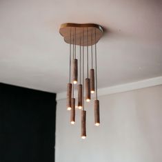 a chandelier made out of wood and lights