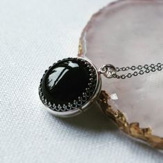 "** Photo insertion service is available for purchase with this locket here: https://www.etsy.com/uk/listing/1267233980/locket-photo-service-add-photo-for-your?click_key=1aa4d8030962c3980bfaa35f7176c9a3e7aed283%3A1267233980&click_sum=35b9b58d&ref=shop_home_active_1&frs=1&cns=1 Tracked shipping is used for ALL orders including international orders. International customers are able to track your orders online and be assured that it will arrive safely and everything is covered.* **Note: this is a p Black Gemstone Necklace For Wedding, Engraved Round Onyx Jewelry, Personalized Black Round Pendant Jewelry, Black Locket For Anniversary, Black Locket Necklace For Anniversary, Black Locket Jewelry For Anniversary, Black Round Engraved Jewelry, Black Enamel Round Jewelry For Weddings, Oval Black Enamel Jewelry Gift