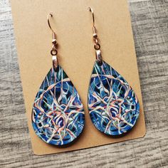 This pair of lightweight, teardrop earrings adds a unique touch, featuring original neuro-inspired artwork, "Cycle of Thought". They are artsy, vibrant and a creative way to advocate for healthy thought patterns. A unique accessory for anyone needing a gentle reminder, but also eye-catching jewelry for those in neuroscience, counseling or medical professions. "We have the power to reclaim our thought life through the simple practice of being aware of our every notion. Even the smallest thoughts can grow in influence to lead us into either a cycle of chaos and despair or life-giving peace and hope." If you are interested in the original artwork that inspired this item or seeing more from the art collection, visit Geinene.com or follow me on Instagram @Geinene .: Made from lightweight, MDF w Adjustable Teardrop Artsy Earrings, Artistic Teardrop Earrings As Gift, Artsy Teardrop-shaped Earrings, Nickel-free Teardrop Artsy Earrings, Artsy Blue Earrings With Artistic Design, Unique Multicolor Teardrop Earrings For Gift, Artistic Teardrop Earrings For Gift, Abstract Design Drop Earrings As Gift, Artsy Abstract Design Jewelry As Gift