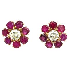 Pretty pair of vintage diamond cluster earrings set in solid 18k Yellow Gold. They are set with Natural Ruby and with two large Round Old European cut Diamonds in the center graded clarity VS, light fancy. Origin Italy 1950 CONDITION: Pre-owned - Excellent METAL: 18k Gold STONE: Diamond 1,0 total carats - Ruby 3,80 ct WEIGHT: 4,9 grams * every jewel is professionally tested by our internal gemological team of specialist I.G.I./HRD **the jewel comes with gemological appraisal and warranty in a ni Diamond Cluster Earrings, Gold Stone, Flower Tops, European Cut Diamonds, Diamond Gold, Ruby Diamond, Cluster Earrings, Natural Ruby, Fun Earrings