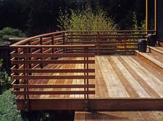 a wooden deck in front of a house