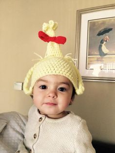 a small child wearing a knitted hat