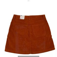 Old Navy Women's Sz 10 Skirt Corduroy Mini Burnt Orange Pockets New With Tags No Flaws Ours Is A Smoke Free Home 189 *See Photos For Approximate Measurements And Fabric Content This Old Navy Women's Skirt Is Perfect For A Casual Occasion. The Burnt Orange Color And Corduroy Fabric Type Give It A Classic Look. The Skirt Is Machine Washable And Has Pockets For Added Convenience. It Is Made Of 67% Cotton, 31% Rayon/Viscose, And 2% Spandex, Making It Comfortable To Wear All Year Round. The Button Cl Casual Corduroy Mini Skirt With Pockets, Casual Corduroy Skirt With Pockets, Casual Corduroy Mini Skirt For Fall, Casual Fall Corduroy Mini Skirt, Casual Corduroy Mini Skirt, Trendy Brown Cotton Skirt, Casual Brown Corduroy Mini Skirt, Brown Corduroy Casual Mini Skirt, Casual Corduroy Skirt For Fall