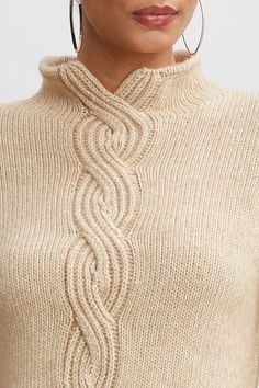 A twist on a classic. The intricate cables of this sweater weave together luxe Italian Melange merino wool and ultra-soft cotton. The cable knit detail & mock neck adds a designer twist to this modern, sporty sweater. Elie Tahari Exclusive Cable Front Sweater 74% Cotton, 26% Merino Runs true to Size Model is 5'9" and wearing size XS Dry Clean Only Imported Style #: E95X6514 Elegant Cable Knit Turtleneck Sweater, Elegant Merino Wool Cable Knit Sweater, Fitted Cable Knit Sweater With Funnel Neck, Merino Wool Cable Knit Sweater With Funnel Neck, Merino Wool Cable Knit Funnel Neck Sweater, Sporty Sweater, Vest Knitting, I Fall To Pieces, Merino Sweater