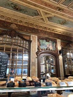 an ornately decorated bakery with bread on display