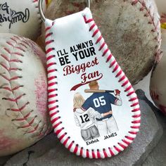 a keychain that has some baseballs and balls on it with the words, i'll always be your biggest fan