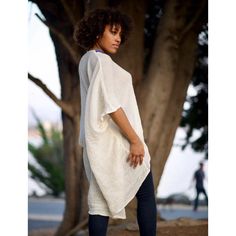 Boldly cozy with a boho twist. Simply-chic layering piece, that dresses up or down for any occasion. Off white with multi-color embroidered trim. 100% cotton V-Neck with a flattering drape. Embroidered Trim made by hand in Ethiopia.Tunic made in California.One size fits most --- One size fits most { the size is loose fit, it will fit from size 2 to size 12 } Machine wash in a delicate cycle or hand wash in cold water. Tumble dry on low heat for a crinkle look. Spring Cotton Tunic Cover-up, Casual White Tunic Cover-up, White Cotton Spring Cover-up, Spring White Cotton Cover-up, Bohemian Cotton Tunic For Daywear, White Cotton Cover-up For Day Out, Casual Cotton Cover-up For Daywear, Casual Cotton Daywear Cover-up, White Long Tunic For Spring