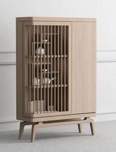 a wooden cabinet with an animal cage on top