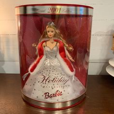 This beautiful Barbie is the 2001 Holiday Celebration Special Edition. She's in the original box, which appears to have never been opened. The box has some shelf wear which we have tried to capture in the photos. The plastic in front is slightly indented in two places. There's no crease, so this might push back out, but I did not want to open the box to do so.  Barbie seems to be in perfect vintage condition. A wonderful addition to any collection.  Thanks for visiting our Etsy shop! Please chec Barbie Christmas Ornaments, Barbie Christmas, Christmas Barbie, Holiday Barbie, Vintage Barbie, Holiday Celebration, Barbie Doll, Barbie Dolls, Doll Toys