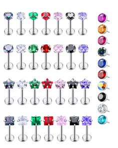 an assortment of different colored jeweled piercings