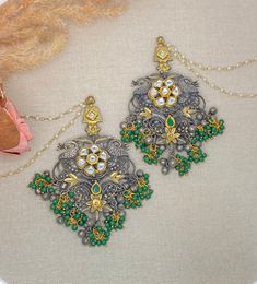 Oxidized statement earrings with pachi kundan work with light sahara(chain).  Dimensions-  Earrings length- 4.5 inches ,  width- 2.2 inches, Chain length- 7 inches Style tip- Pair it with any beautiful traditional outfits  and flaunt with Unique style of collection from us. Perfect match for Festival and Traditional wear.  Take Care Tips-  Kee away from perfume, Hair spray and. Moisture.  Store in dry place , Ziplock bag or Airtight box.    Clean with dry cloth.  Jewellery is the last thing you Festive Oxidized Kundan Necklace, Fusion Style Kundan Necklace For Wedding With Oxidized Finish, Fusion Style Kundan Necklace With Oxidized Finish For Wedding, Festive Oxidized Kundan Necklace For Celebrations, Chandbali Kundan Necklace With Oxidized Finish For Celebrations, Celebration Chandbali Kundan Necklace With Oxidized Finish, Heavy Metal Fusion Jewelry, Silver Chandelier Earrings With Oxidized Finish For Festive Occasions, Oxidized Finish Earrings For Wedding And Diwali