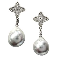 Perfectly pretty and easy to wear, these new platinum post earrings by Eytan Brandes feature frosty silver-blue Japanese saltwater cultured (i.e., Akoya) pearls dangling from pointy little platinum quatrefoils pavé-set with tiny diamonds. The pearls (each around 8.7mm) are from Seven Seas Pearls, our trusted pearl dealer going back decades. Seven Seas deals only in saltwater pearls (Tahitian, South Sea and Akoya) -- no freshwater and nothing from China. This particular pair is notable for its si Classic Silver Platinum Pearl Earrings, Elegant Silver Platinum Pearl Earrings, Exquisite Silver Teardrop Pearl Earrings, Luxury Silver Pearl Drop Earrings, Silver Platinum Pearl Earrings For Anniversary, Silver Briolette Pearl Earrings For Anniversary, Luxury Silver Teardrop Pearl Earrings, Silver Pear-shaped Sterling Silver Diamond Earrings, Elegant Silver Briolette Earrings