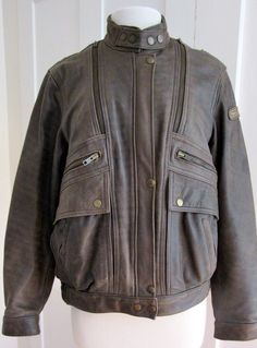 "1980s Motorcycle Leather Bomber Jacket 4 outside pocket, 2 with zippers , 2 with snaps. 1 inside pocket with a snap. Nylon lining 4 zip air vents,2 in front, 2 in back, starting at the shoulders. 2 snaps at neck, 1 just below neck, and 3 snaps at waist. Row of snaps inside, I think it originally came with an insulated lining. You might be able to find one. Size - 40 = US Woman's 10 Bust - 42\" Waist - 42\" Hips - 39\" Arm - 24\" Shoulder - 16.5\" Length - 23\" Sleeve Zippers - 5.5\" Condition - Vintage Winter Biker Jacket With Flap Pockets, Vintage Biker Jacket With Zipper For Outdoor, Vintage Biker Jacket With Flap Pockets For Winter, Vintage Biker Jacket With Zipper Closure For Outdoor, Vintage Outdoor Biker Jacket With Zipper Closure, Vintage Outerwear With Ykk Zipper For Fall, Vintage Winter Biker Jacket With Pockets, Vintage Motorcycle Jacket, Motorcycle Jacket Women