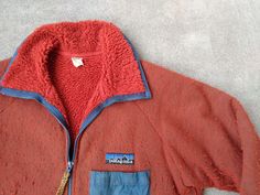 For sale is a vintage Patagonia Reverse Pile fleece jacket.  This jacket is in good gently used condition with holes or stains, part of the velcro seam on the chest pocket is loose but the velcro is intact and functional (see pictures).  Nice thick material, hand pockets and a chest pocket, rare and hard to find.   Patagonia, 100% Polyester and Nylon trim, Large, made in USA.  Thanks!   pit to pit: 23.5   length: 28  arm from center of collar: 34 Hip Hop Street Fashion, Hiking Winter, Mountain Gear, Fishing Jacket, Vintage Patagonia, Orange Jacket, Snow Fashion, Rap Tee, Zipper Jacket