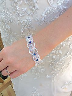 "This is just a lovely crystal bracelet for that special occasion. It has such intricate details that sparkle oh so special in the light with a touch of midnight blue for added interest in Swarovski crystal and bugle beads. The AB crystals and beads pick up the colors around them so they reflect beautifully with any color you wear. The bracelet measures 8\" from clasp to clasp end. Beaded bridal bracelet with blue Swarovski crystals, AB beads., and clear crystal beaded bracelet. Check out the earring that match this lovely bracelet also. Thanks for visiting!" Clear Crystal Bracelet, Blue Crystal Bracelet, Swarovski Crystal Bracelet, Crystal Suncatchers, Natural Stone Jewelry, Crystal Beads Bracelet, Beaded Drop Earrings, Bracelet Blue, Bugle Beads