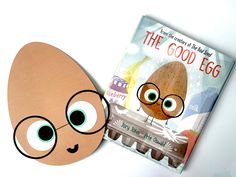 an egg is next to a children's book with the words the good egg on it