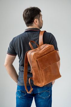 ● Large leather cognac backpack with big inside and outside pockets ● ● Large backpack is made by hand from genuine leather. Has three inner pockets and one large outer pocket with a flap. This backpack is suitable for both men and women. It can be used in everyday life for work, study, sports and travel. The backpack is made of high-quality genuine leather that guarantees its durable use.● ● Easily fits a 15.6 '' laptop in this backpack ● ● Unique leather over time gets better. A bag can be mad Classic Cognac Backpack For Travel, Classic Cognac Travel Backpack, Cognac Backpack With Leather Backing For Travel, Cognac Leather-backed Backpack For Travel, Cognac Leather Standard Backpack, Daily Use Standard Backpack In Cognac, Cognac Leather Backpack, Cognac Leather Travel Backpack, Everyday Use Cognac Backpack