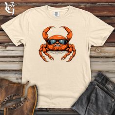 Get ready to crawl in comfort with this Coastal Crab Tee! Made from heavy cotton, this shirt is perfect for a day at the beach or a casual evening out. Featuring a playful crab design, it's sure to bring smiles wherever you go. Embrace Ultimate Comfort and Timeless Style: Introducing the Comfort Colors 1717 Heavy Cotton Tee! Experience the epitome of comfort and classic charm with the Comfort Colors 1717 Heavy Cotton Tee. This timeless piece offers a perfect blend of cozy softness and effortless Crab Design, Coastal Vibes, Reptiles Pet, Casual Evening, Life Of The Party, Comfort Colors Tee, Perfect Wardrobe, Blue Jean, Tee Design