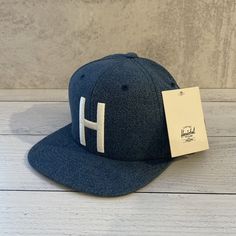 Herschel Supply Co. Toby Snapback Denim Adjustable Snapback Hat Cap Brand New With Tags Casual Navy Flat Cap, Navy Casual Flat Cap, Casual Snapback Flat Cap For Spring, Blue One Size Flat Cap Baseball Cap, Blue Adjustable Flat Cap Snapback Hat, Adjustable Blue Flat Cap Snapback Hat, Denim Snapback Hat, Adjustable Denim Baseball Cap With Flat Bill, Casual Navy Adjustable Snapback Hat